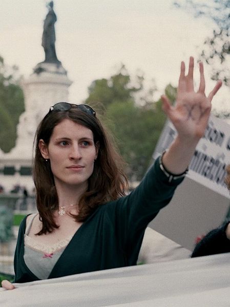 A transgender woman protests discrimination at a Paris demonstration <a target="_blank">(Photo: Wikipedia)</a>
