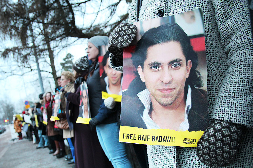 A demonstration for the release of Badawi outside the Saudi Arabian Embassy in Helsinki <a target="_blank" href="https://www.flickr.com/photos/amnestyfinland/16400102552/in/photolist-qKPKXr-qGR3pZ-qZix76-qGHNY3-qGR2ZR-v6aM3M-uNqQGv-uNhPCU-v3yEfA-v3yDmS-rpgBPy-qY5JpL-qFzLbw-qFAWCo-qFJE66-qFzL2J-qGSErp-qZix2r-qZdP7Q-qX1kVq-qGSE1z-qZdNzh">(Photo: Amnesty Finland)</a>