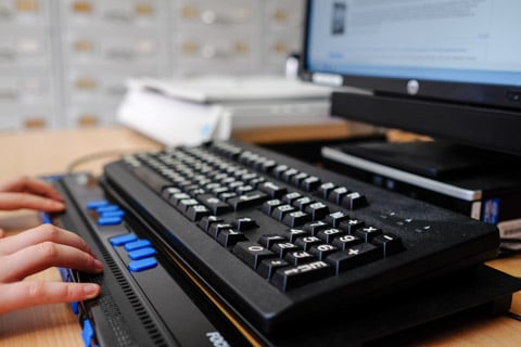 Assistive technology like braille keyboards can greatly improve workplace accessibility, the report authors point out (Photo: DNB, Stephan Jockel)