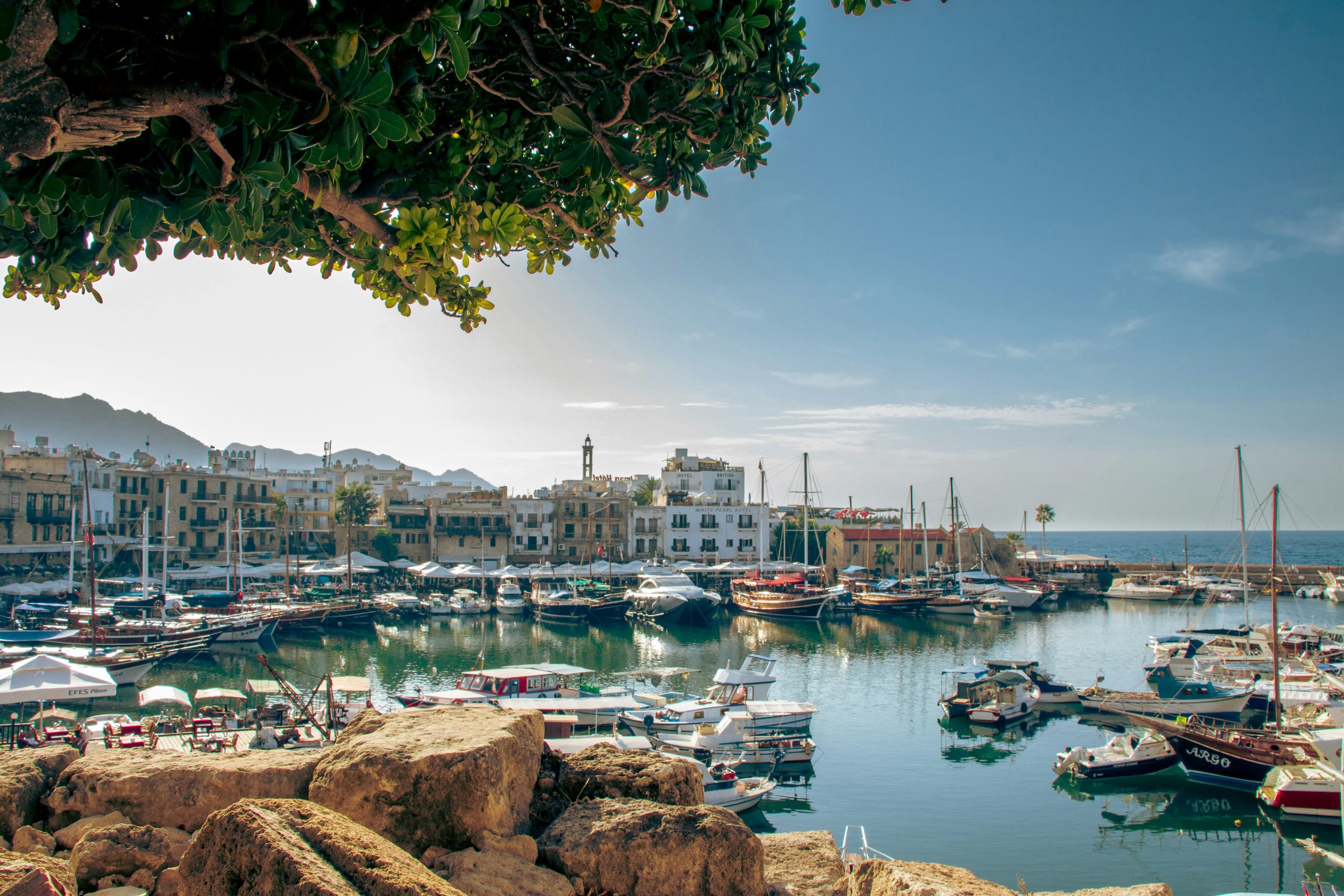 Cyprus financial clean-up measures have not been cost-free. Russian tourism has collapsed by more than 90 percent since 2019, inward investment from Russia has fallen sharply, and longstanding commercial ties have been unwound <a target="_blank" href="https://unsplash.com/photos/a-harbor-filled-with-lots-of-boats-on-top-of-a-body-of-water-sZ8zn03gFKU">(Photo: Katerina Bot)</a>