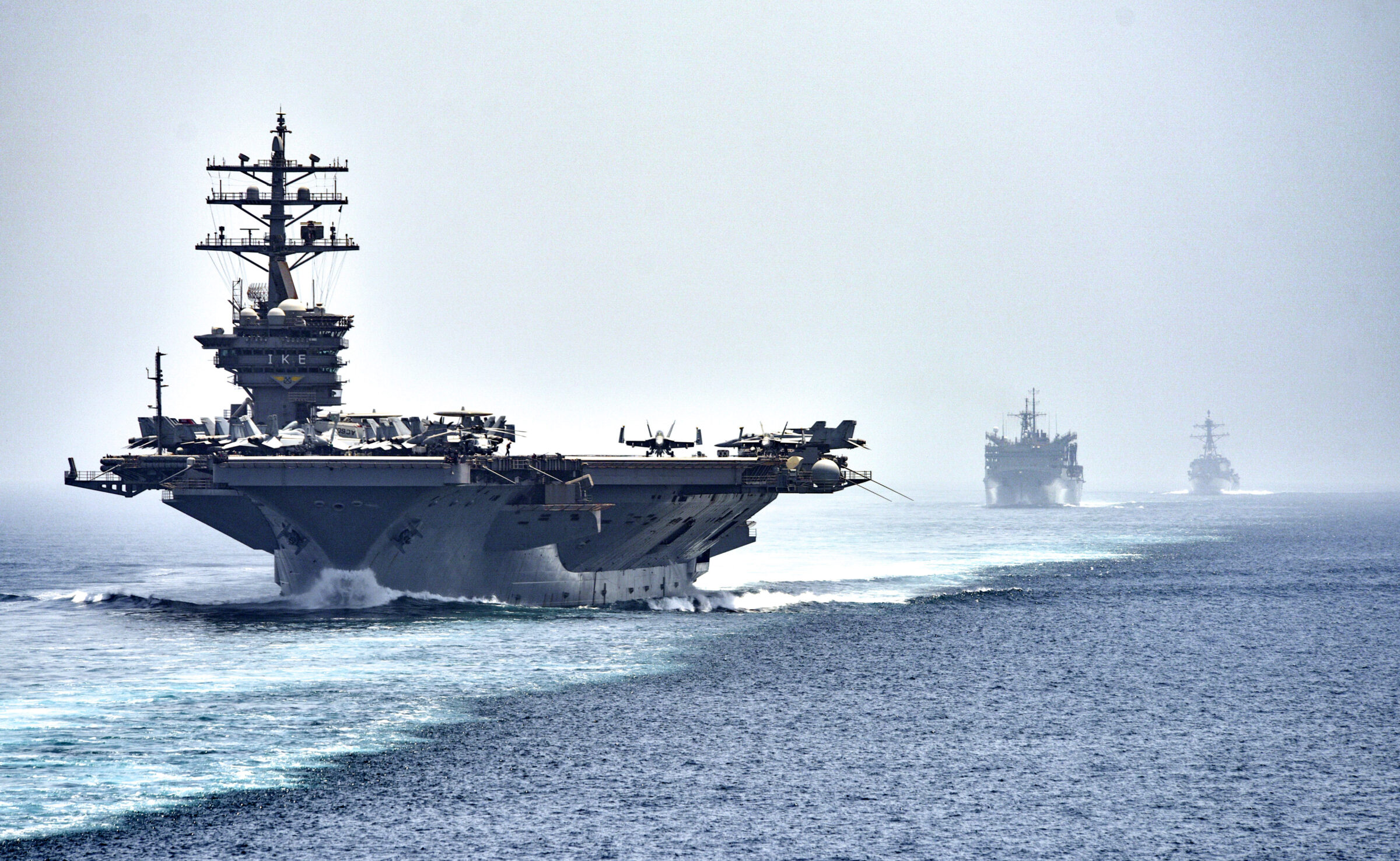 160721-N-OR652-449
STRAIT OF HORMUZ (July 21, 2016) The aircraft carrier USS Dwight D. Eisenhower (CVN 69), followed by the fast combat support ship USNS Arctic (T-AOE 8) and the guided-missile destroyer USS Nitze (DDG 94), transit the Strait of Hormuz. The Eisenhower Carrier Strike Group is deployed in support of maritime security operations and theater security cooperation efforts in the U.S. 5th Fleet are of operations. (U.S. Navy photo by Mass Communication Specialist 3rd Class J. Alexander Delgado/Released)
