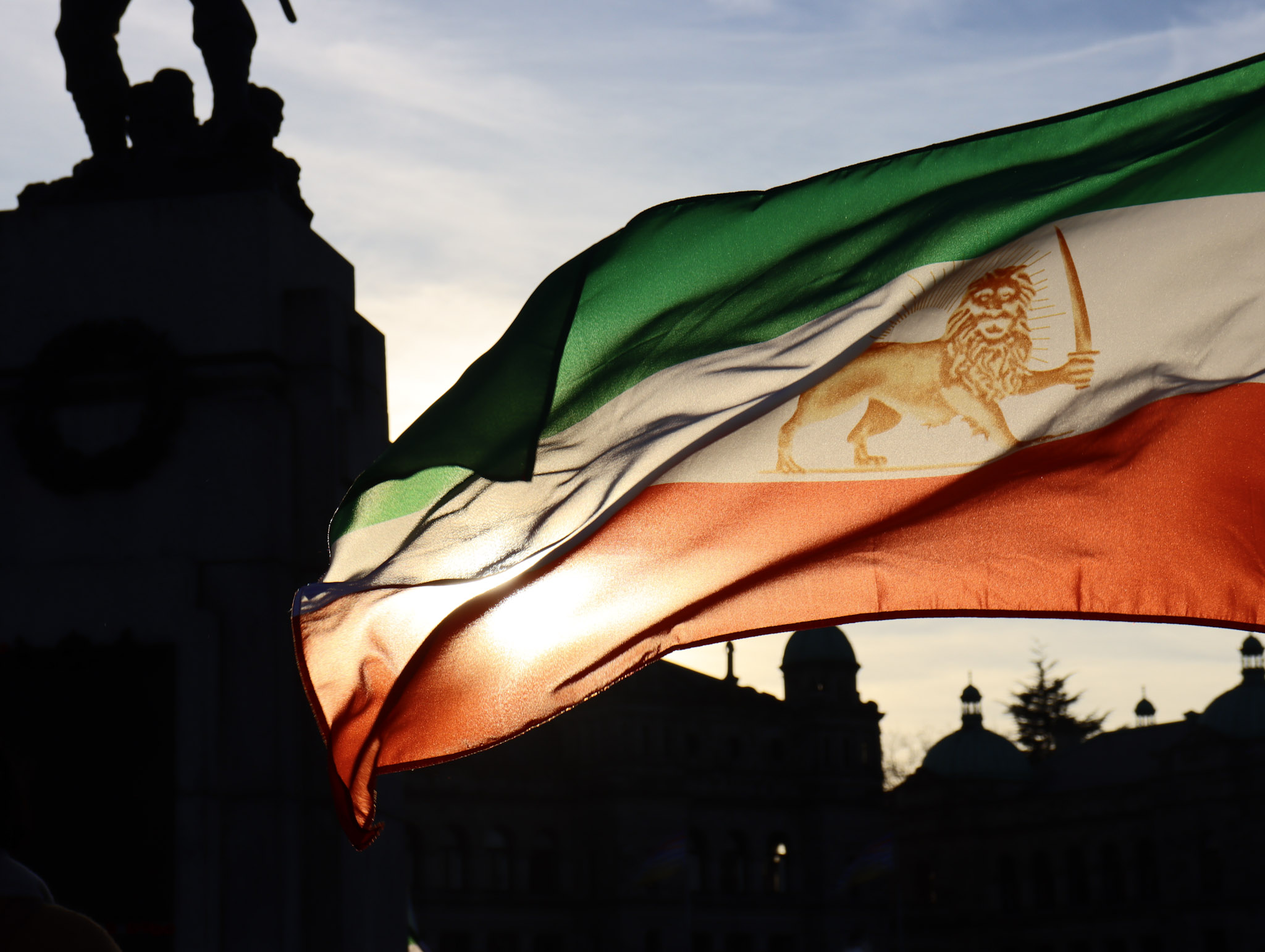 Iran's pre-179 'Lion and Sun' flag flown at a 'Woman Life Freedom' solidarity protest in Victoria, Canada, 19 November 2022