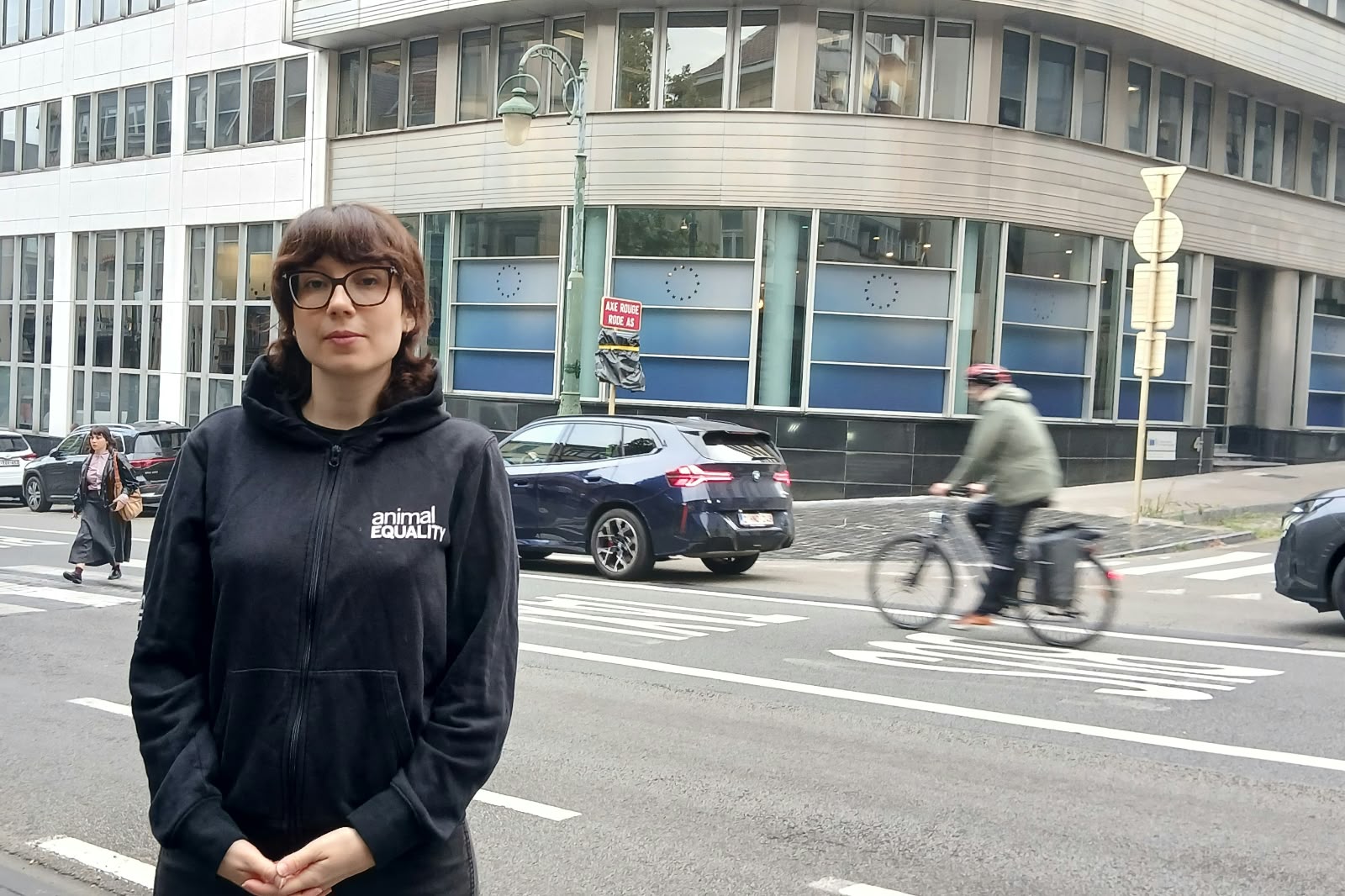 Person stands infront of EU institute.